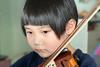 Travis Wong Kai Xuan playing violin