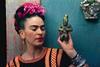 Frida Kahlo with Olmec figurine, 1939. Photograph Nickolas Muray. © Nickolas Muray Photo Archives