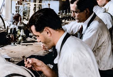 Poss lead -Kovanda working in Lewis workshop colorized c1930s