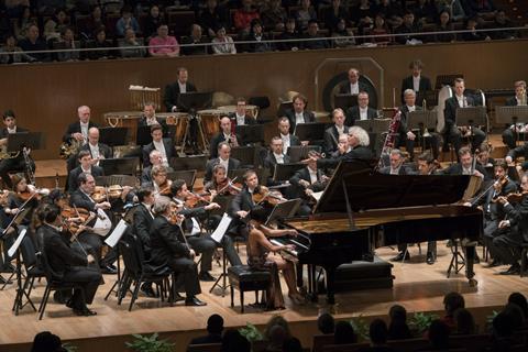 Simon Rattle and the Berlin Philharmonic on tour in Shanghai in 2017, with soloist Yuja Wang