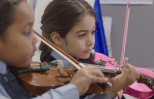 Children playing violins