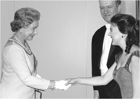 Tasmin Little meeting HM Queen Elizabeth II in 1991 after her performance with the Royal Liverpool Philharmonic Orchestra. John Lill, who also participated in the concert, looks on.