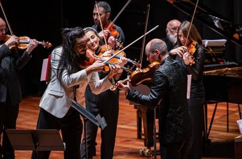 Sparks and bow hair flying: Nemanja Radulović and Philharmonia players. Photo: Marc Gascoigne