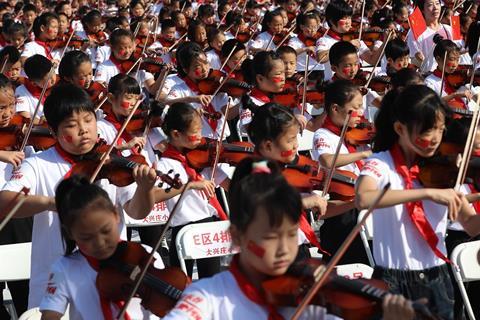 Young violinists playing in Pinggu