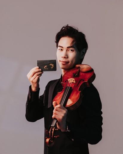 Timothy Chooi with the 'Dolphin' Stradivari. Photo: Curtis Perry