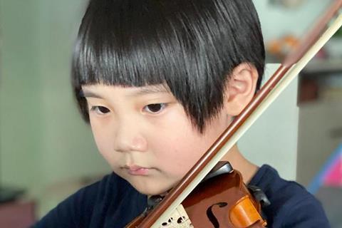 Travis Wong Kai Xuan playing violin