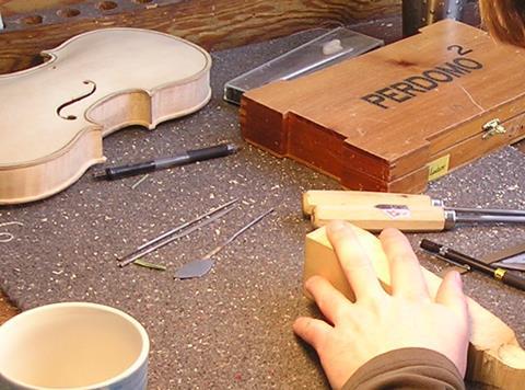 A_violin_scroll_and_finger_board_in_the_making